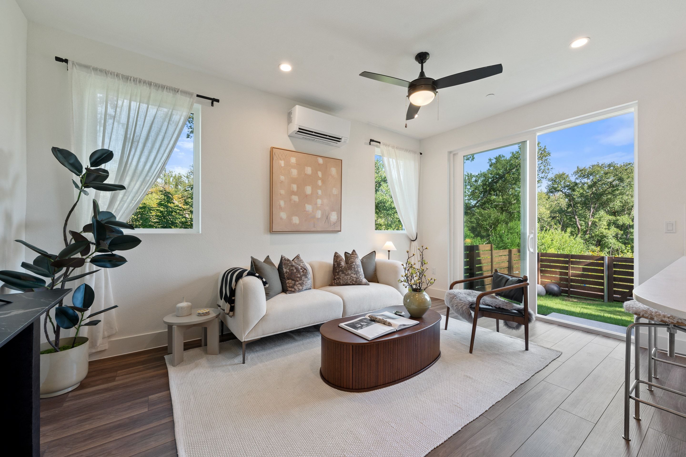 Staged living room at Overlook opening to the yard