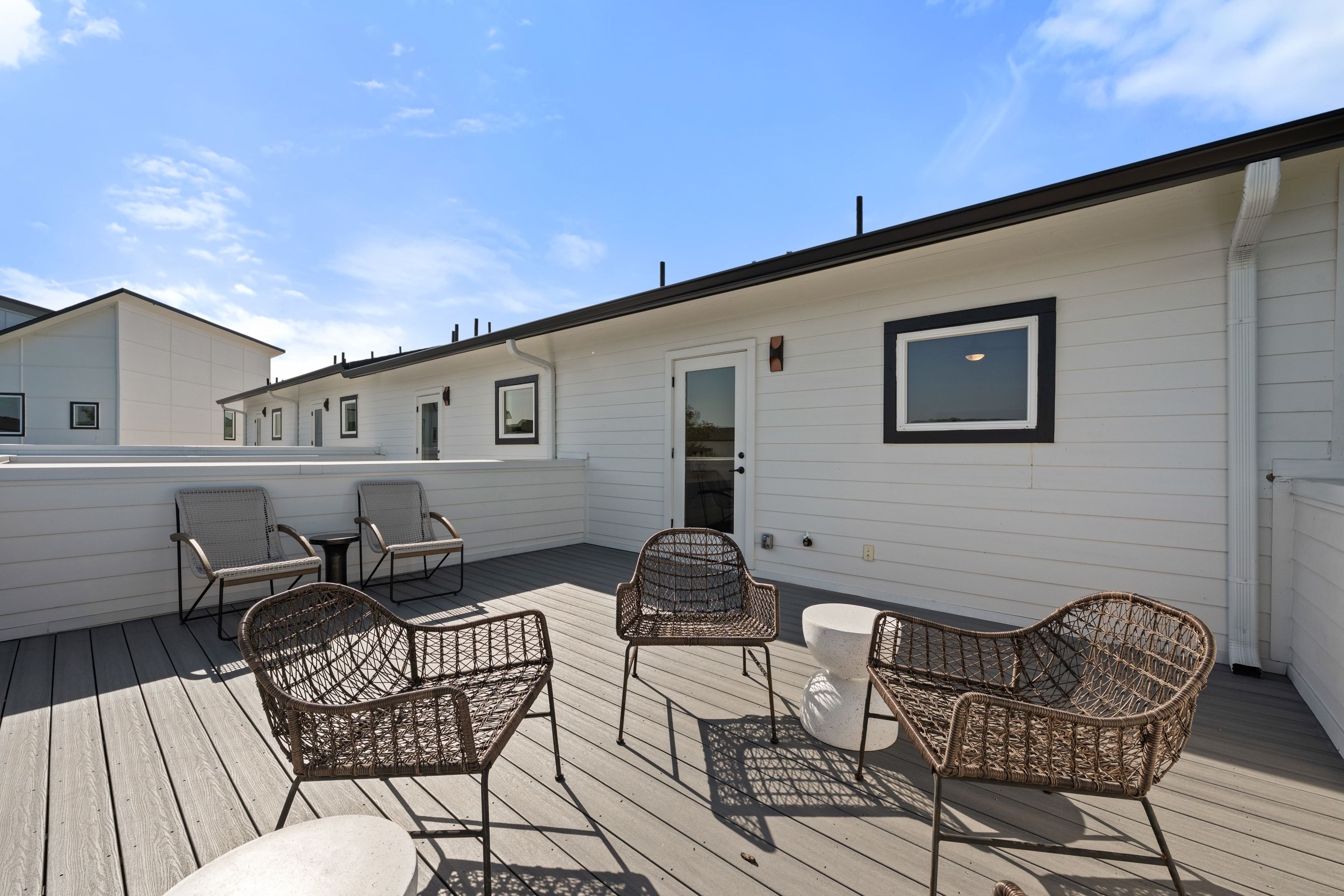 Perch plan rooftop terrace with lounge seating and treeline views