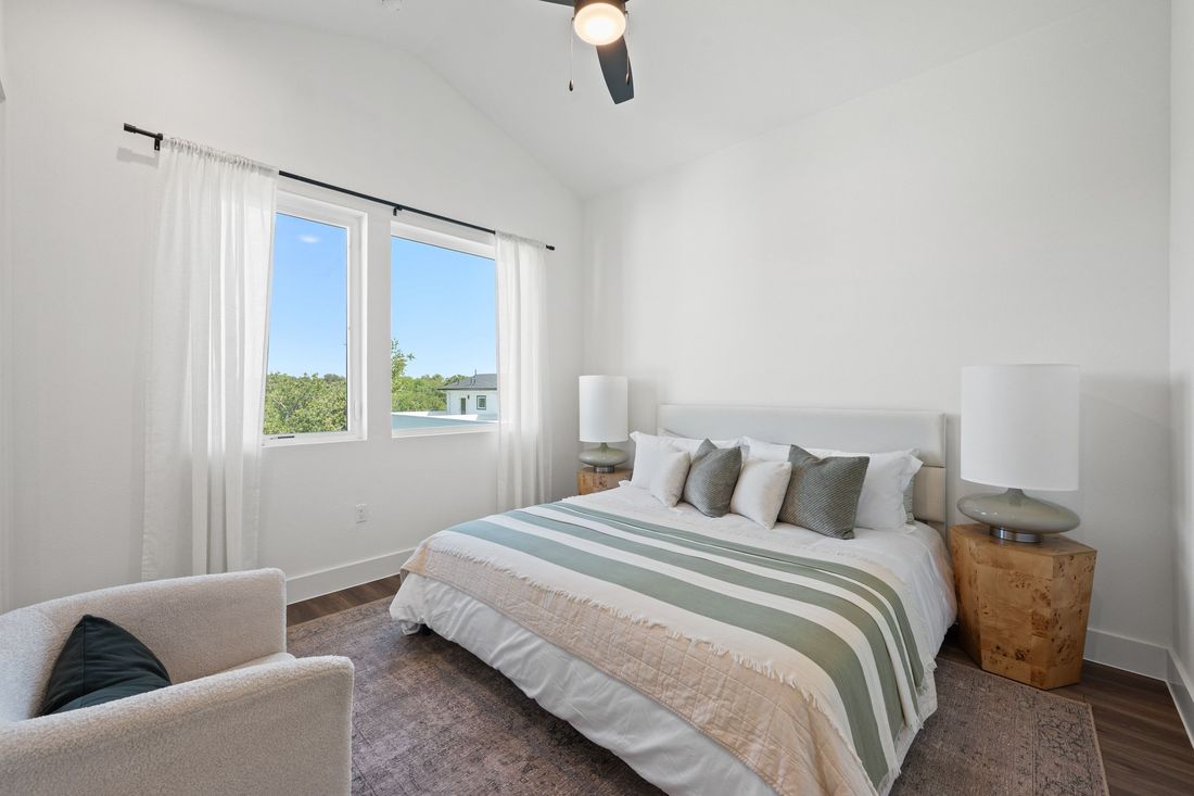 Primary bedroom, staged, with natural light