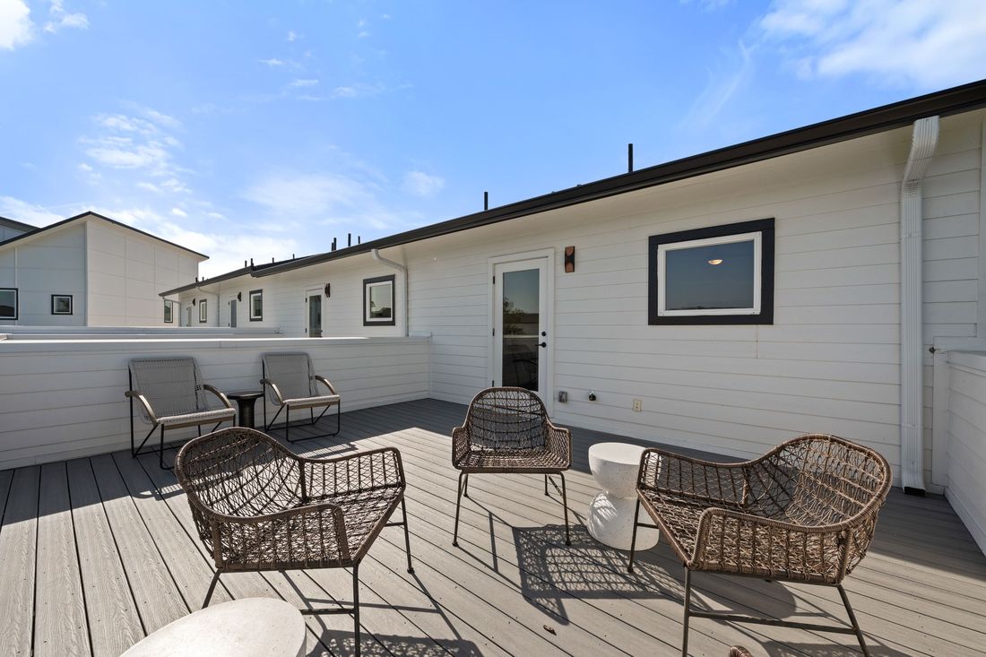 Rooftop terrace with seating and open sky